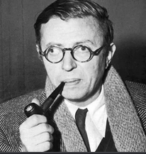 Picture of a bespectacled, wild-eyed Jean Paul Satre with a pipe of tobacco a shirt and ties and a scarf